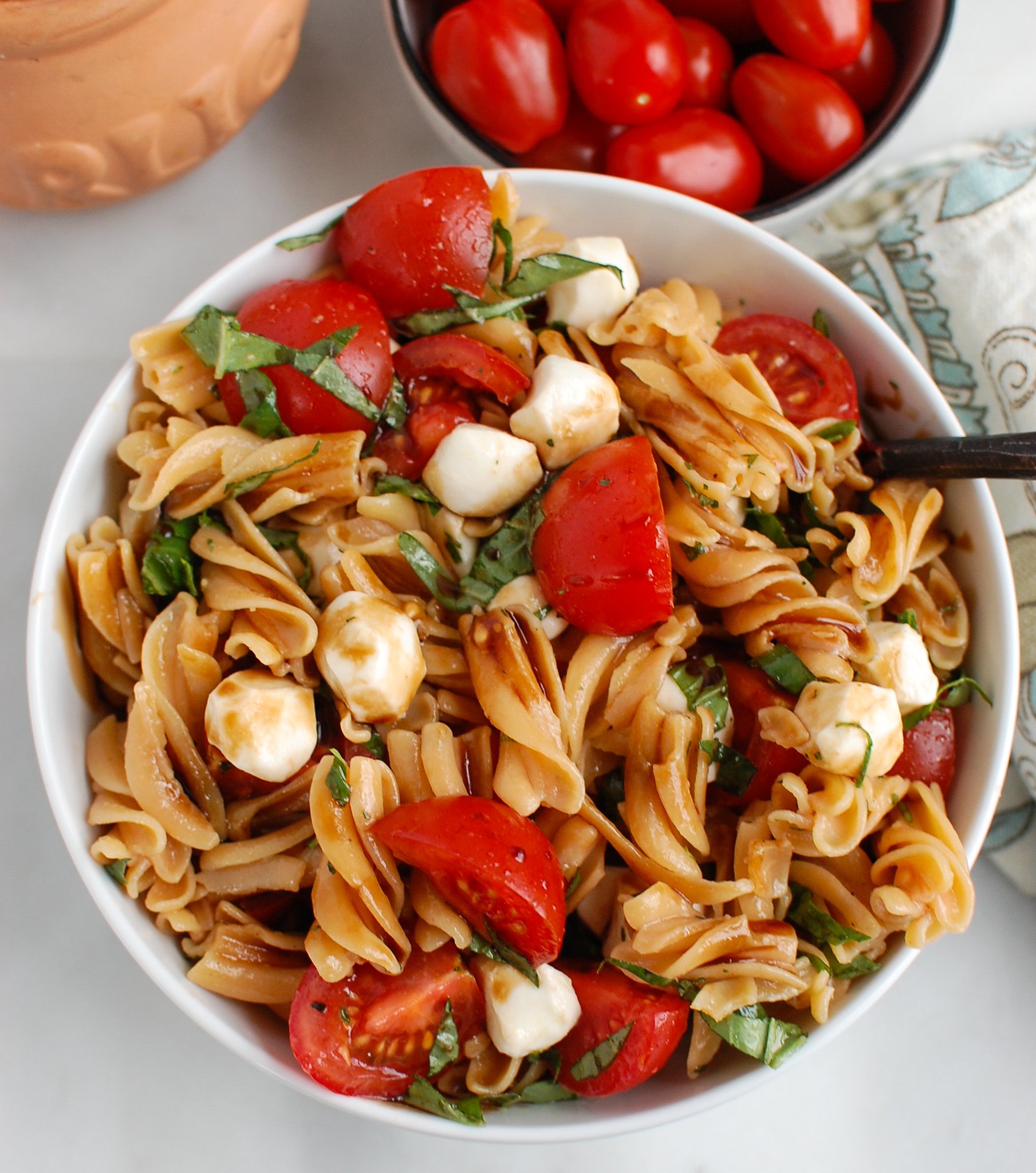 Caprese Pasta with spoon