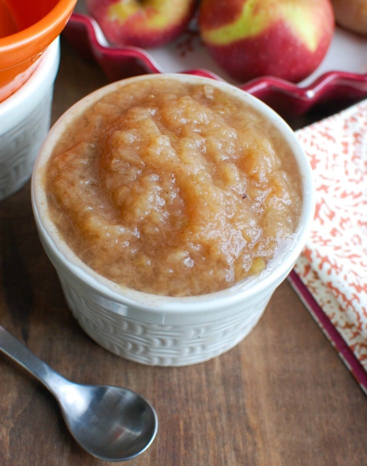 Crockpot Applesauce with a spoon.