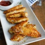 Healthy Baked Chicken Fingers are oven baked to create a healthier tender. The panko crust is crunchy and has good flavor from the spices. These are a kid and adult favorite!