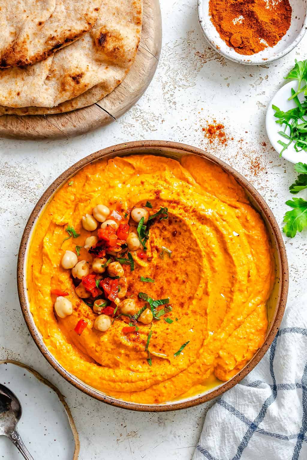Roasted Red Pepper Hummus in a bowl with chickpeas 