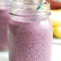 Blueberry Banana Smoothie Recipe with blue straw.