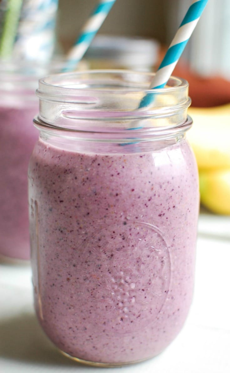 Blueberry Banana Smoothie Recipe with blue straw.