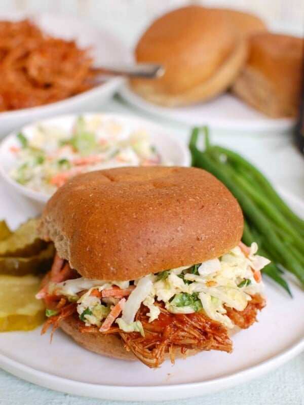 Barbecue Pulled Pork is a pork shoulder crock pot recipe, made with a flavorful BBQ sauce. This slow cooker pulled pork recipe makes the perfect sandwich or even a filling for quesadillas! 