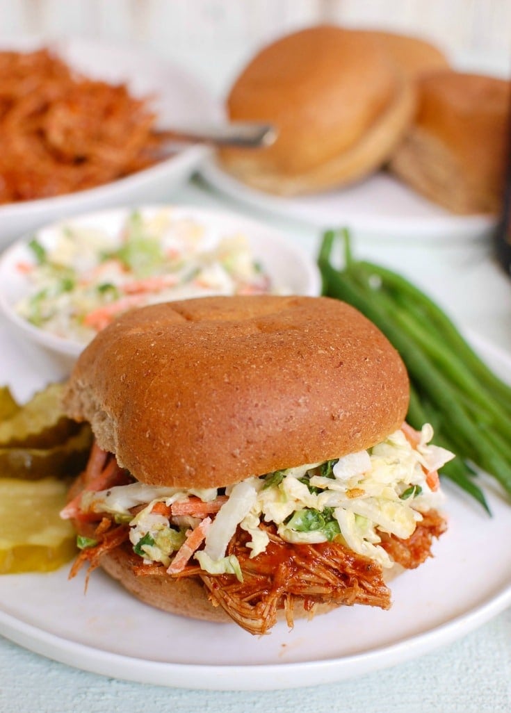 Barbecue Pulled Pork is a pork shoulder crock pot recipe, made with a flavorful BBQ sauce. This slow cooker pulled pork recipe makes the perfect sandwich or even a filling for quesadillas! 