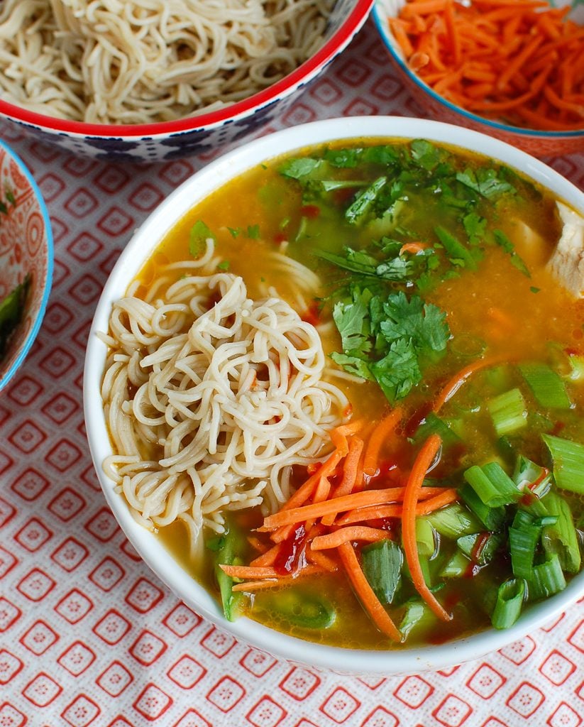 Asian Chicken Noodle Soup in a white bowl 