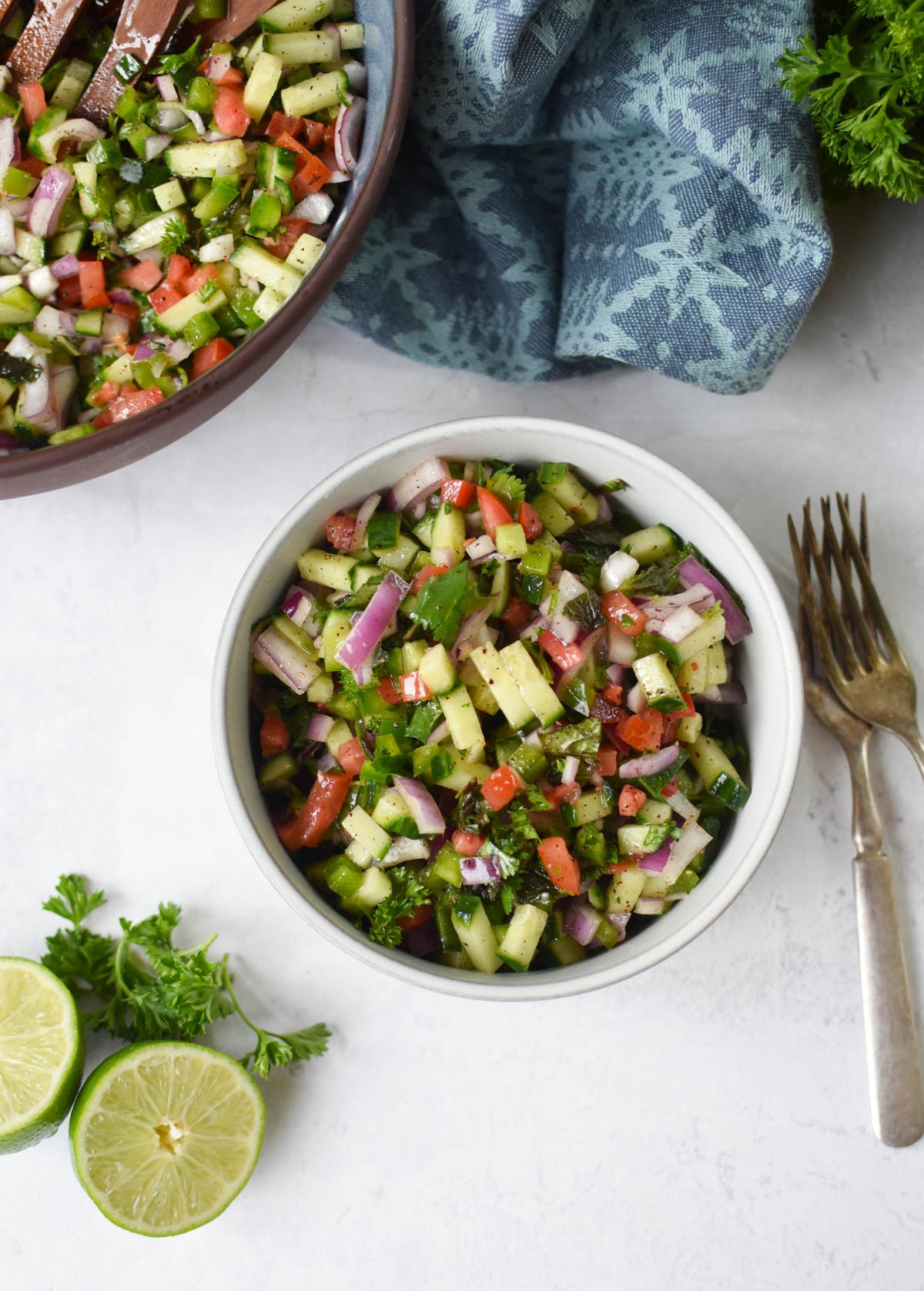Shirazi Salad Recipe in white bowl with forks.