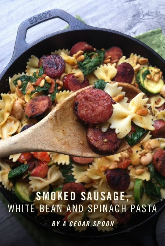 Smoked Sausage Pasta with White Beans, Spinach, and Toasted Pine Nuts