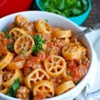 One Skillet Cheesy Hamburger Pasta is a quick and easy one skillet or pot meal mixing ground beef, tomatoes, cheese and pasta to create a cheesy hamburger dish.  The leftovers reheat wonderfully so you have options for lunch and dinner later in the week!