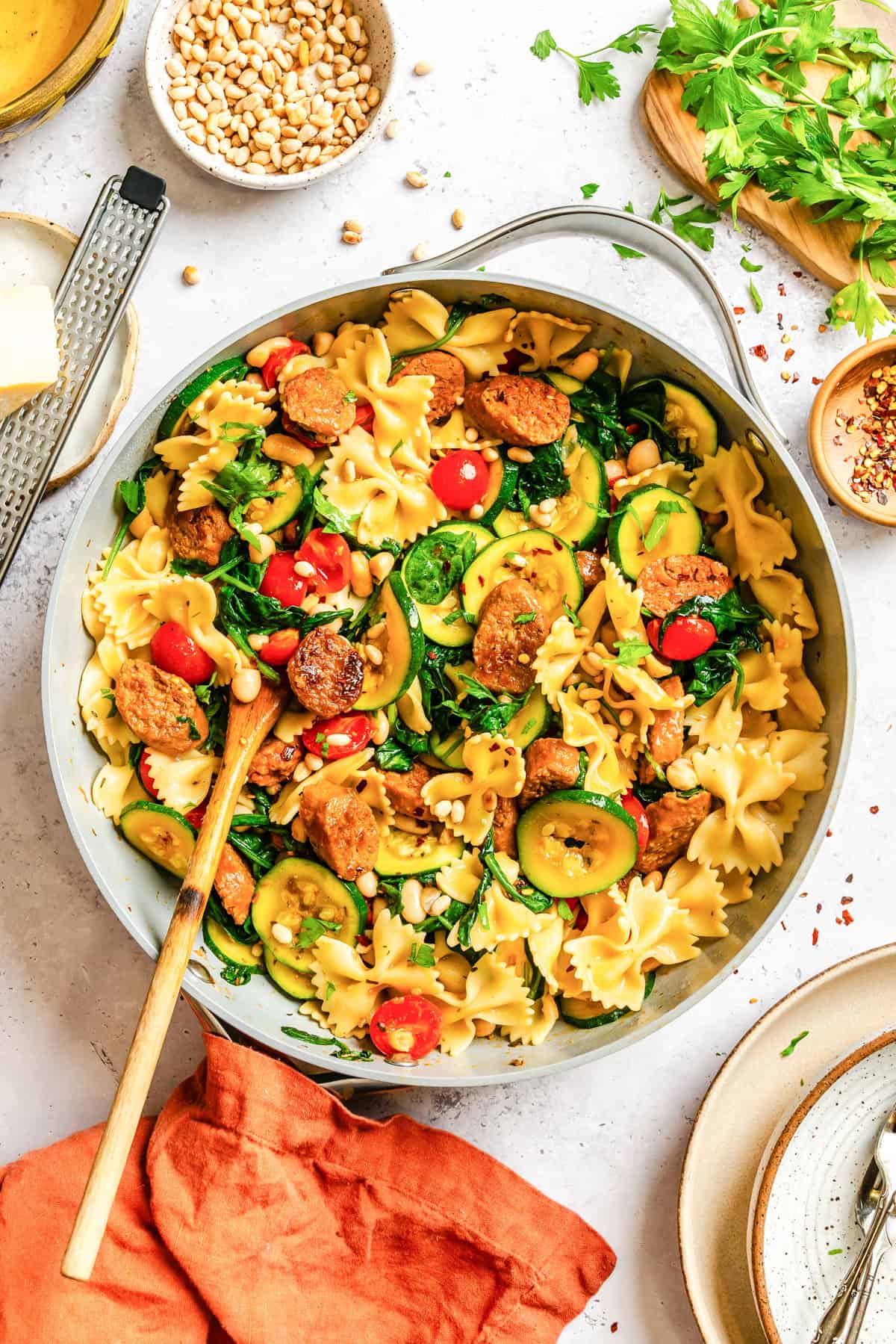Simple Smoked Sausage Pasta in a skillet with a spoon 