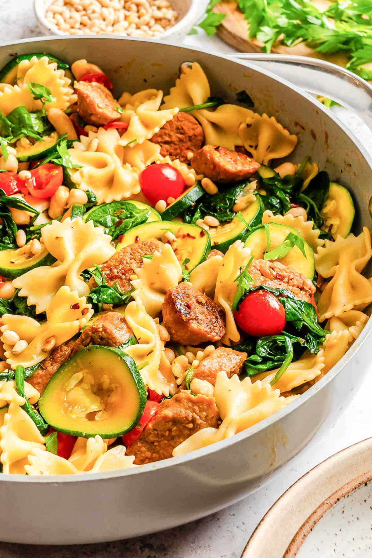 Smoked Sausage Pasta with White Beans in a pan 