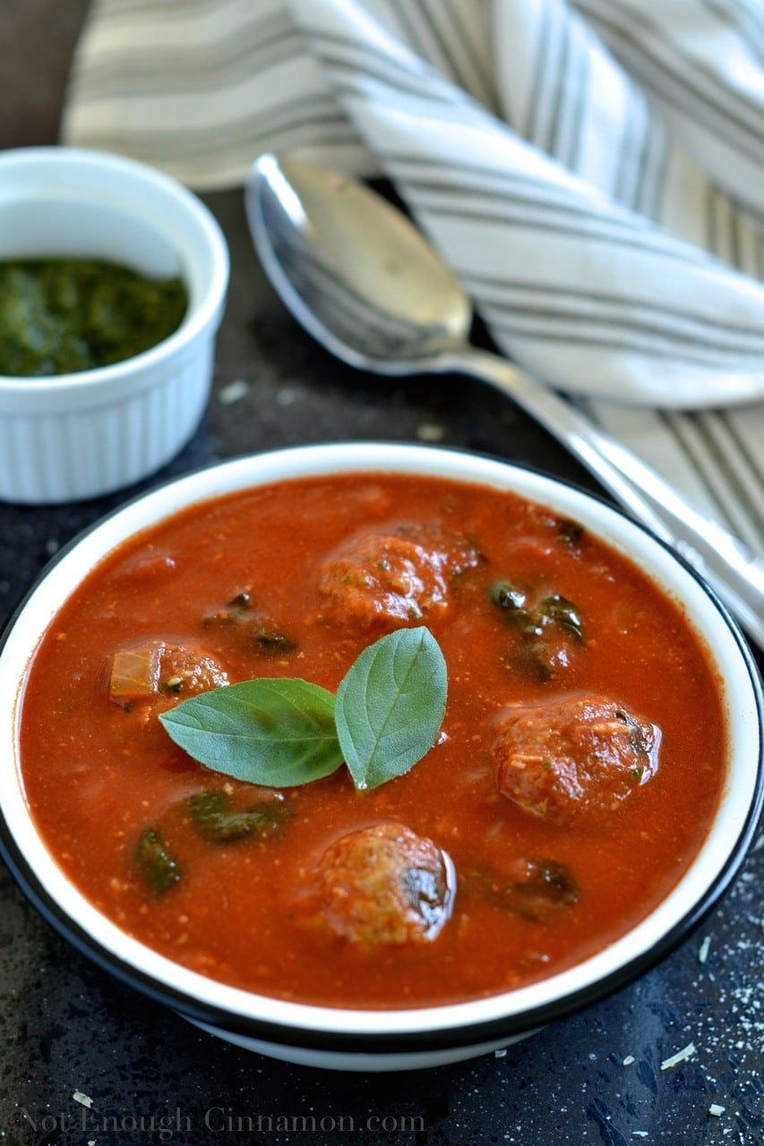 Spinach and Tomato Soup Recipe with spoon.