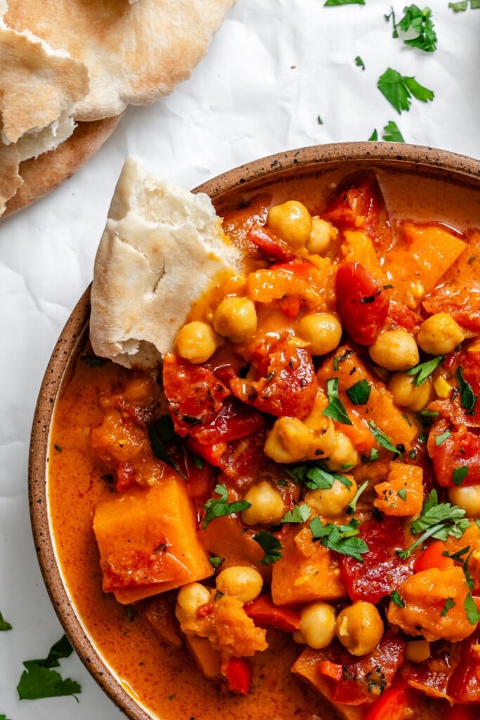 Butternut Squash Chickpea Curry in bowl with pita