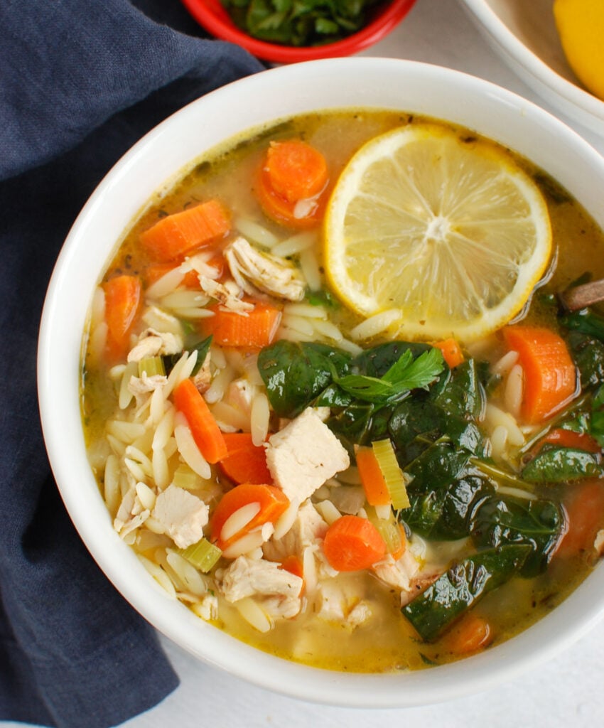 Lemon Chicken Orzo Soup in white bowl