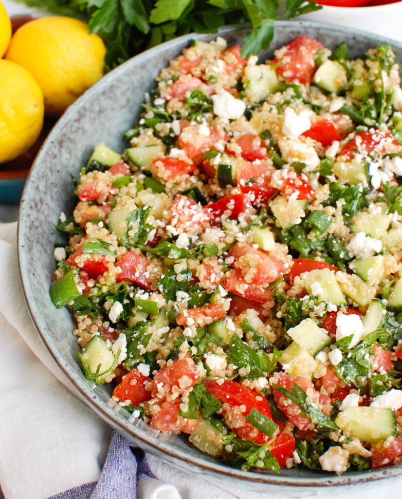 Tomato Cucumber Feta Quinoa Salad in a blue bowl 