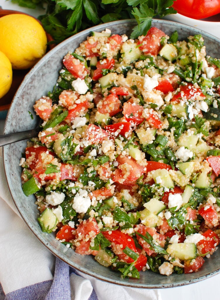 Tomato Cucumber Feta Quinoa Salad with spoon 