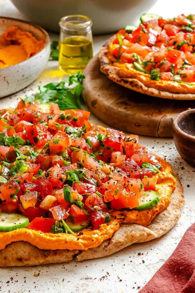 Mediterranean Naan Pizza on a cutting board with parsley 