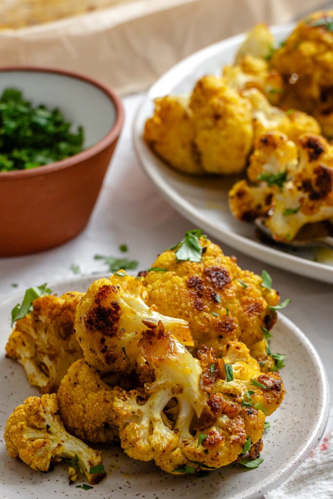 Curry Roasted Cauliflower on a white plate 