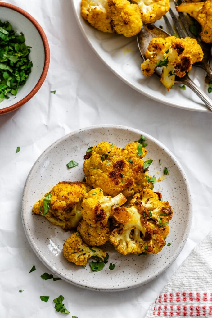 Curry Roasted Cauliflower on small white plate 