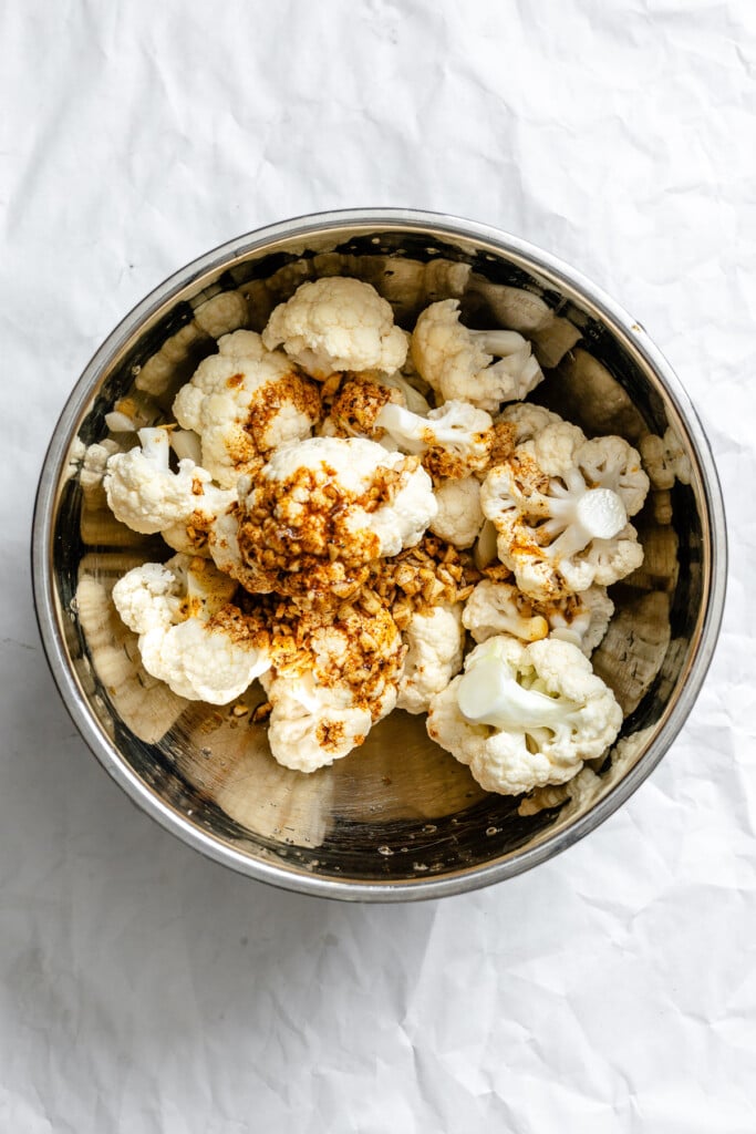 Curry Roasted Cauliflower in a bowl with spices 