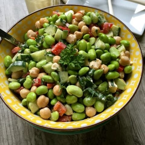 Edamame Chickpea Feta Salad with Lemon Tahini Dressing with parsley.