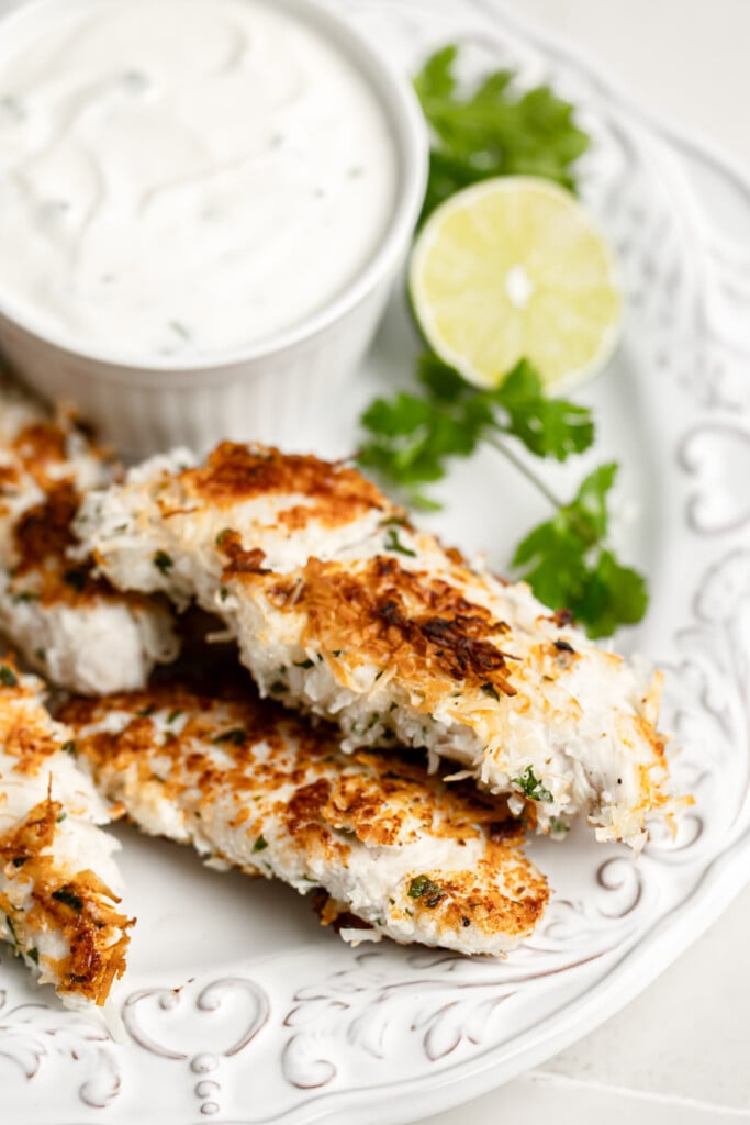 Coconut Chicken Tenders on a white plate 
