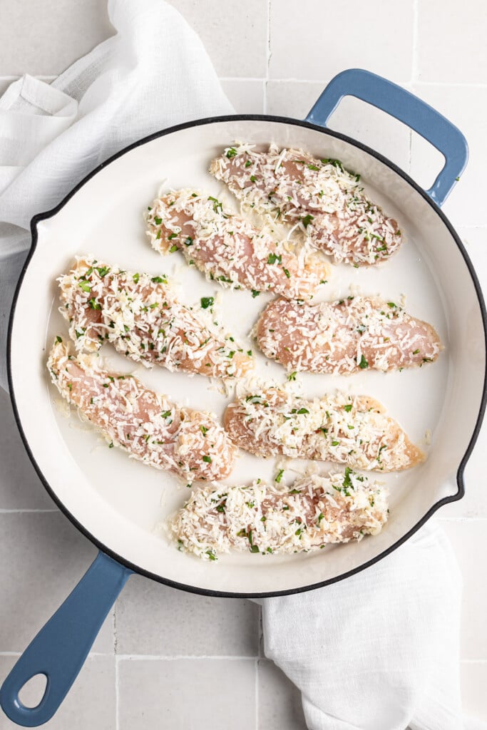 Coconut Chicken Tenders in a skillet 