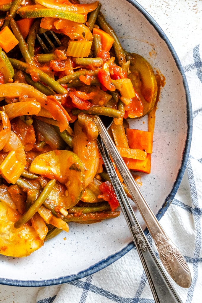 Lebanese Vegetables in a blue rimmed bowl with forks