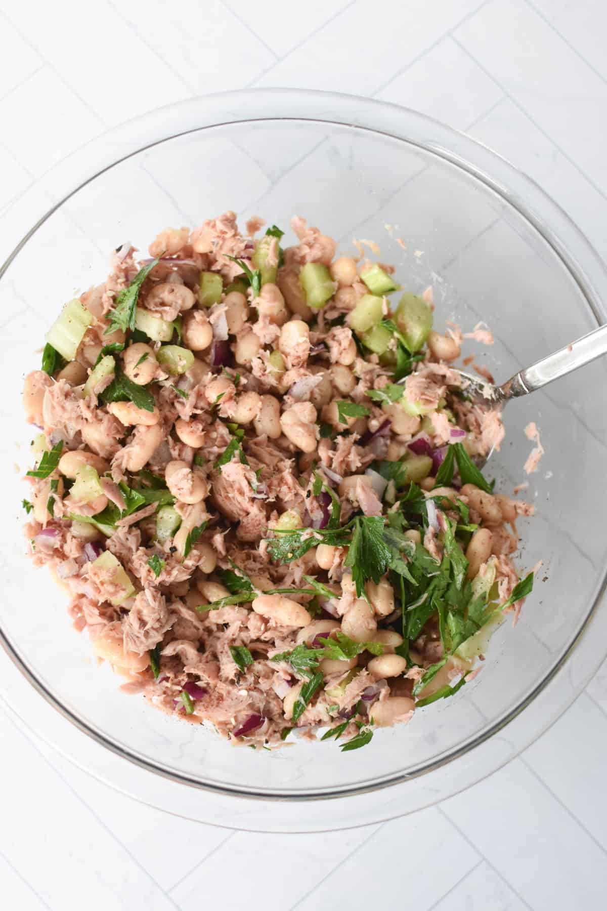 Tuna Bean Salad in a clear bowl 