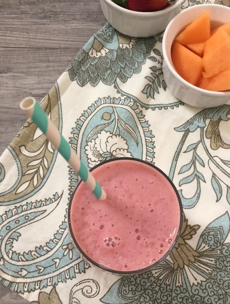 Strawberry Cantaloupe Smoothie with straw.