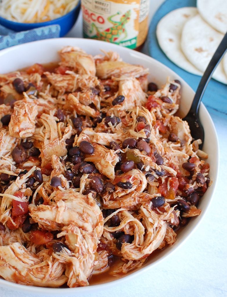 Slow Cooker Shredded Chicken in a white bowl