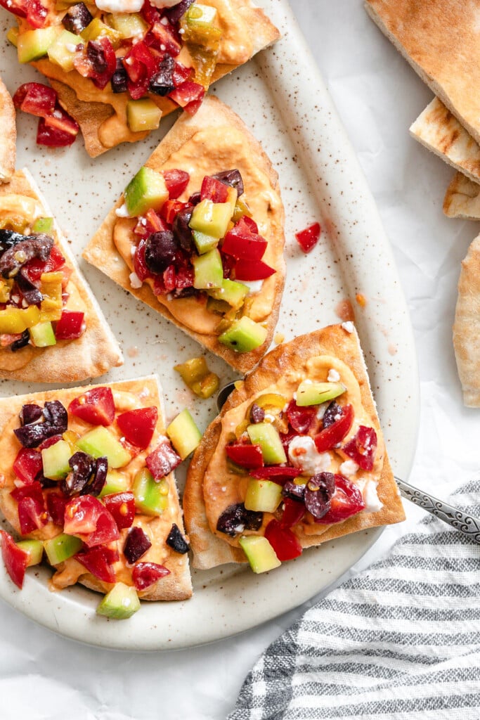 Loaded Hummus Pitas on a white plate