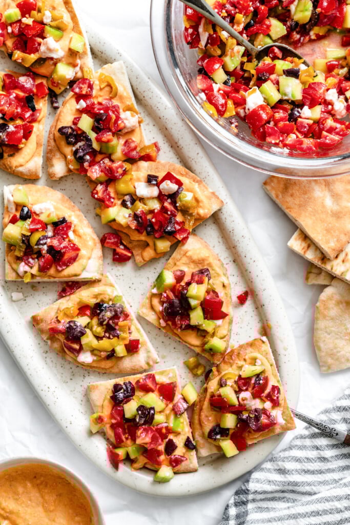 Loaded Hummus Pitas on a white plate 