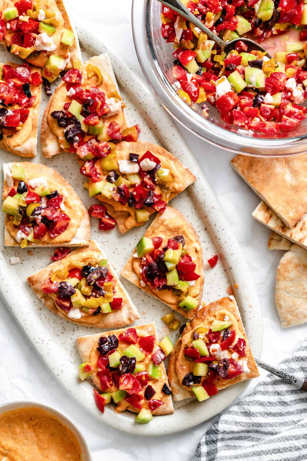 Loaded Hummus Pitas on a white plate