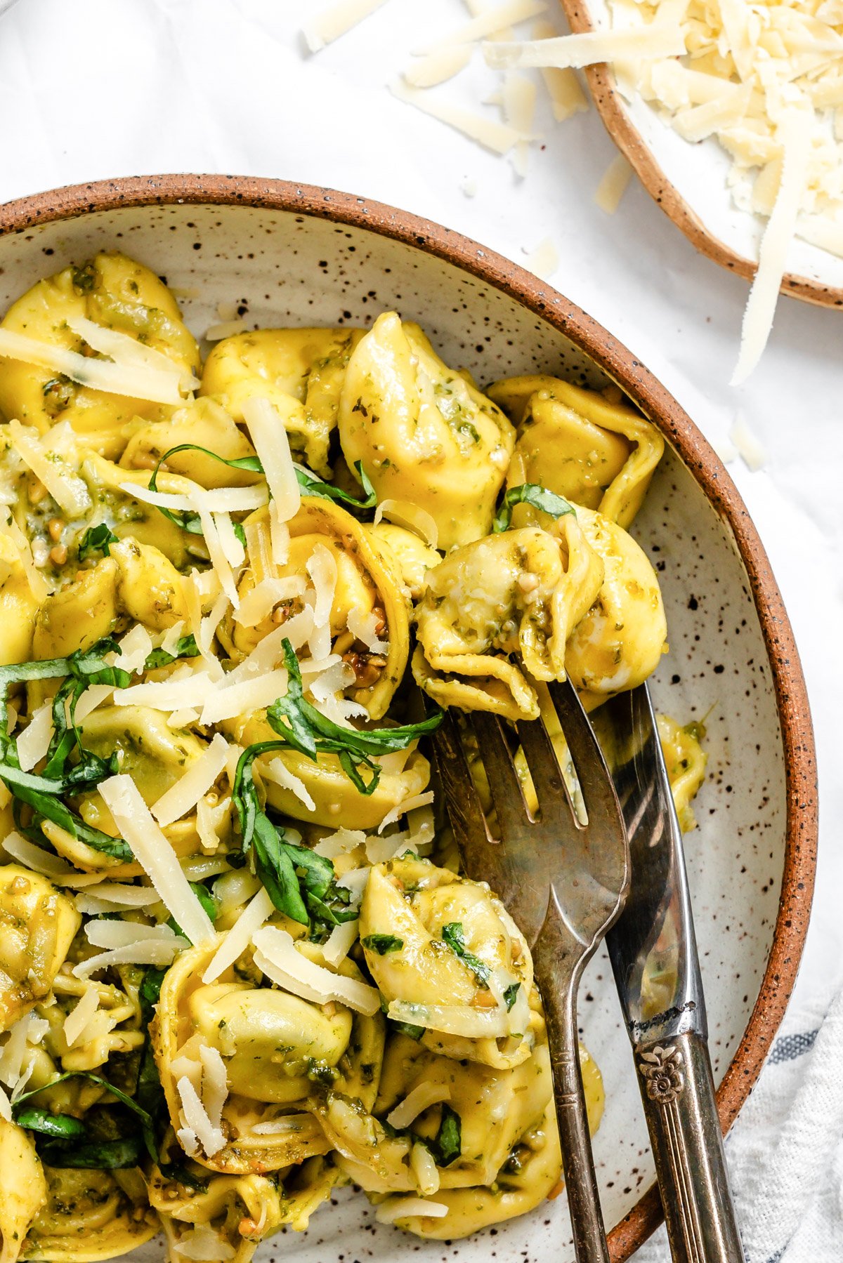 tortellini in a bowl  with a fork and knife  