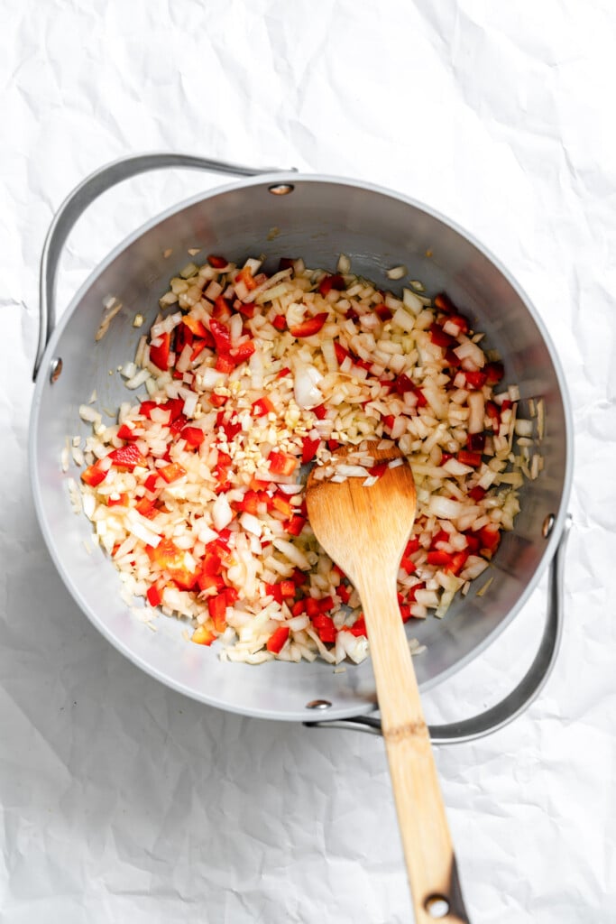 Lentil Bean Chili sautéing veggies in a skillet 