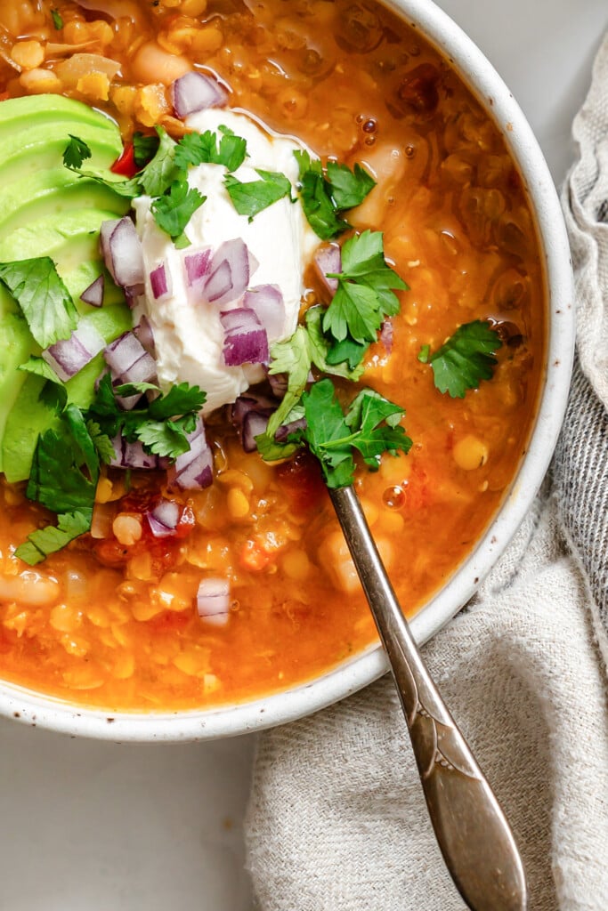 Lentil Bean Chili with a spoon in a bowl 