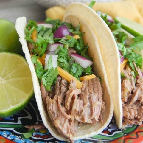 Slow Cooker Shredded Beef Tacos with garnishes