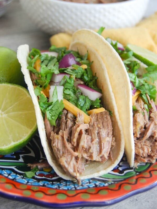 Slow Cooker Shredded Beef Tacos with garnishes