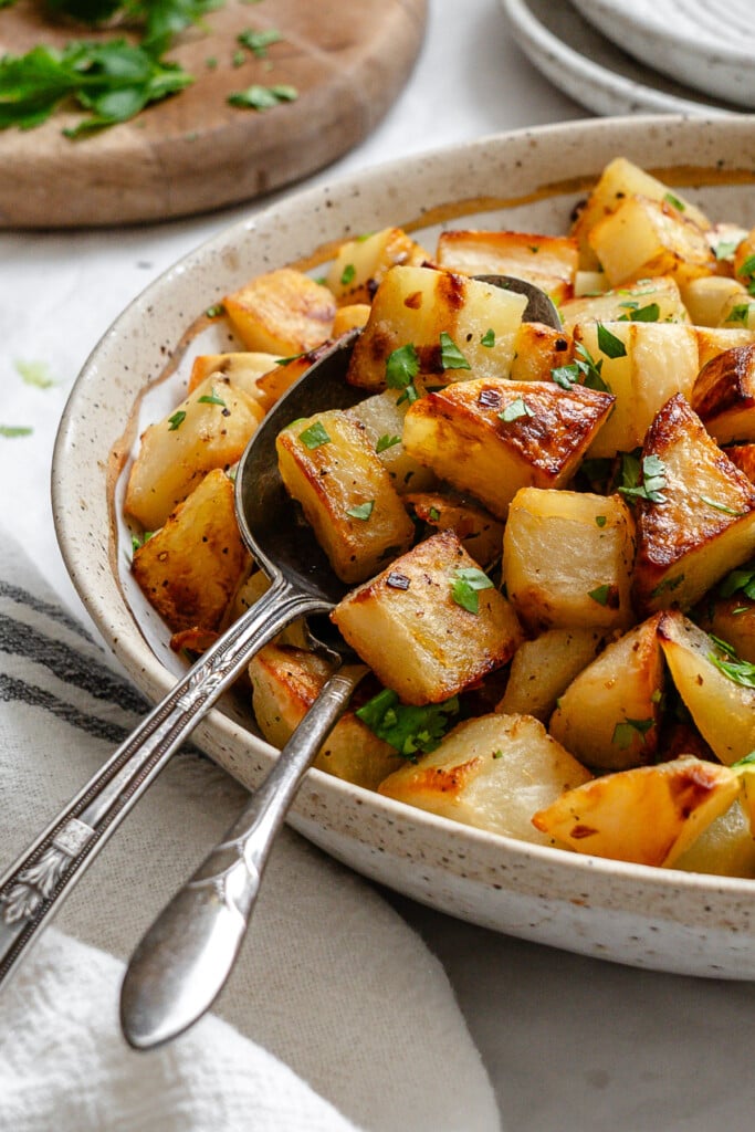 Lemon Cilantro Roasted Potatoes in a white bowl