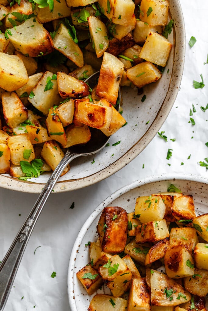 Lemon Cilantro Roasted Potatoes in bowl with spoon 