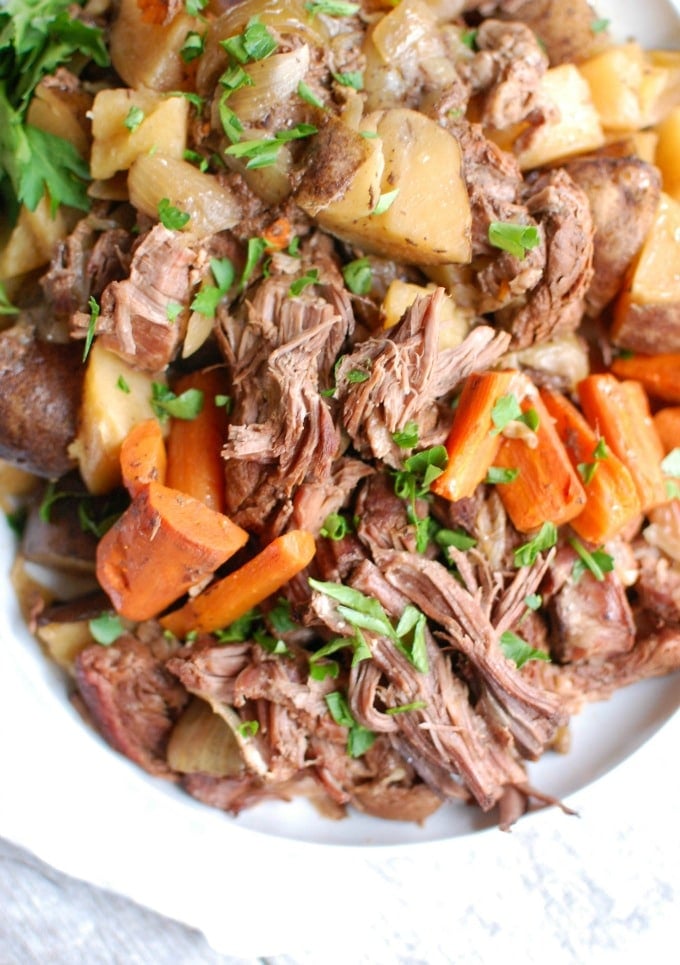 Crockpot Chuck Roast Recipe on white plate 