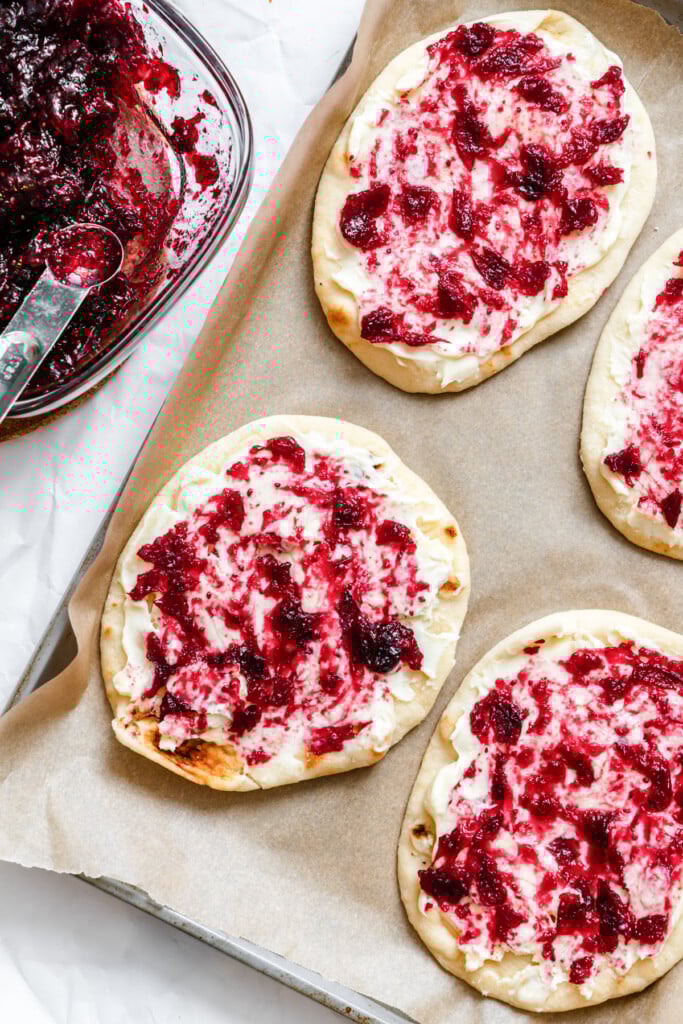 Warm Brie Cranberry Naan Bread with sauce on naan