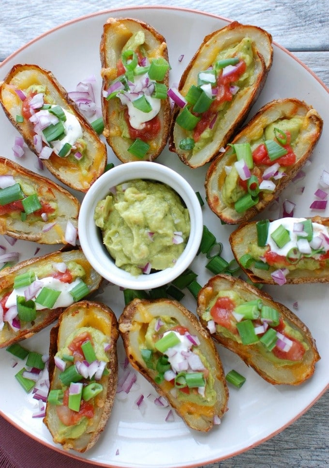 Guacamole Stuffed Potato Skins on white platter