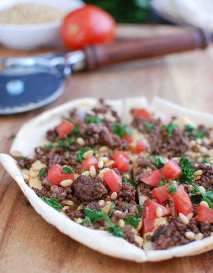 Spiced Beef and Hummus Pita Pizza on cutting board 