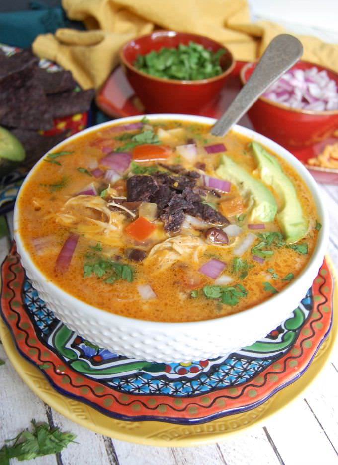 Slow Cooker Mexican Cheesy Chicken Soup in a white bowl