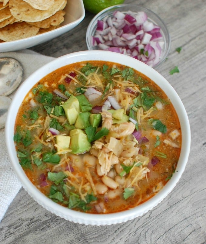 Slow Cooker White Chicken Chili with a spoon and napkin.