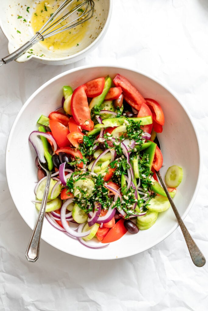 Greek Village Salad vegetables in a bowl with herbs 