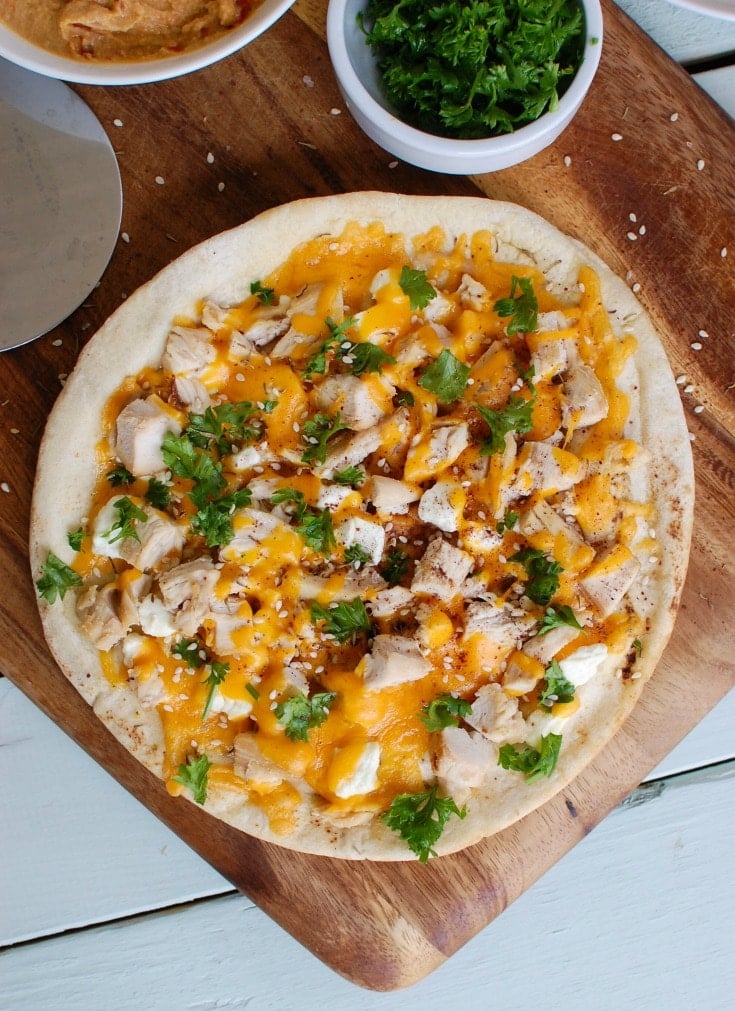 Chicken Feta Cheddar Pita Pitza with cheese and parsley. 