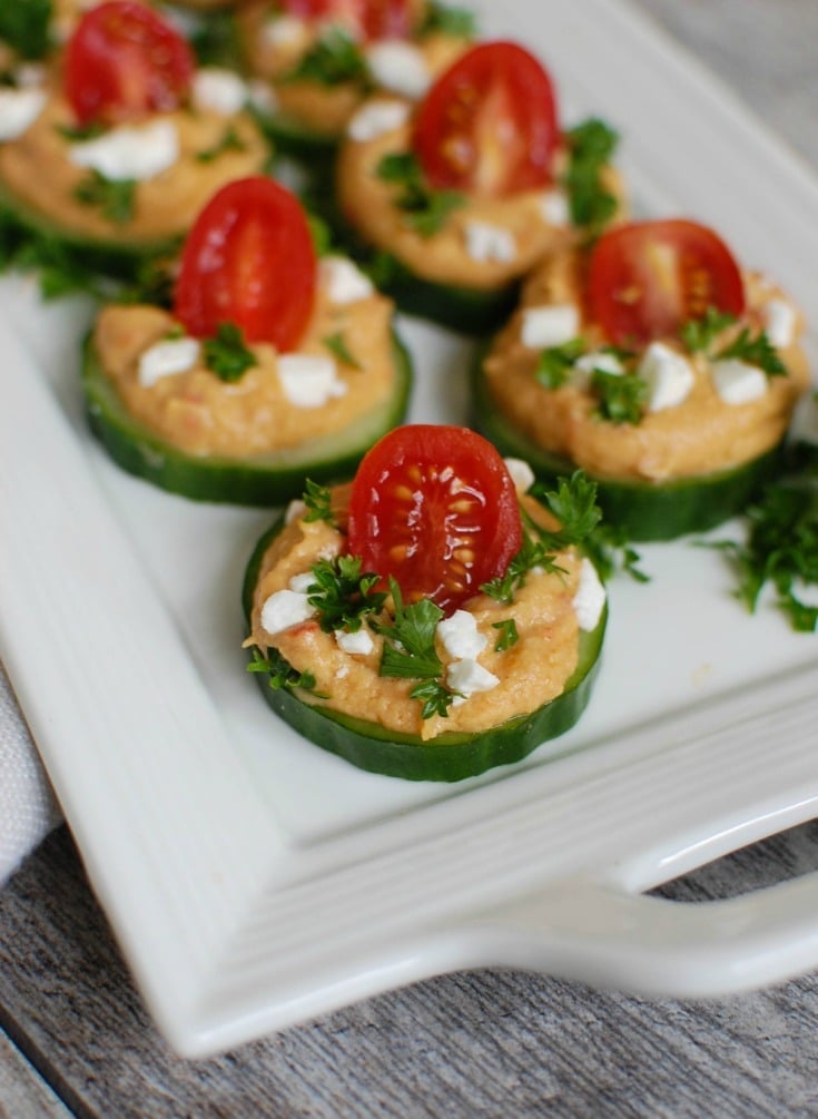 Cucumber Hummus Bites on white plate