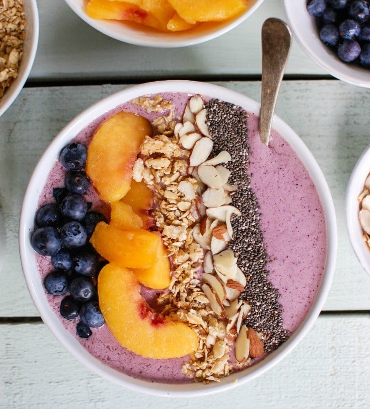 https://www.acedarspoon.com/wp-content/uploads/2016/06/Peach-Blueberry-Smoothie-Bowl-Image-2.jpg